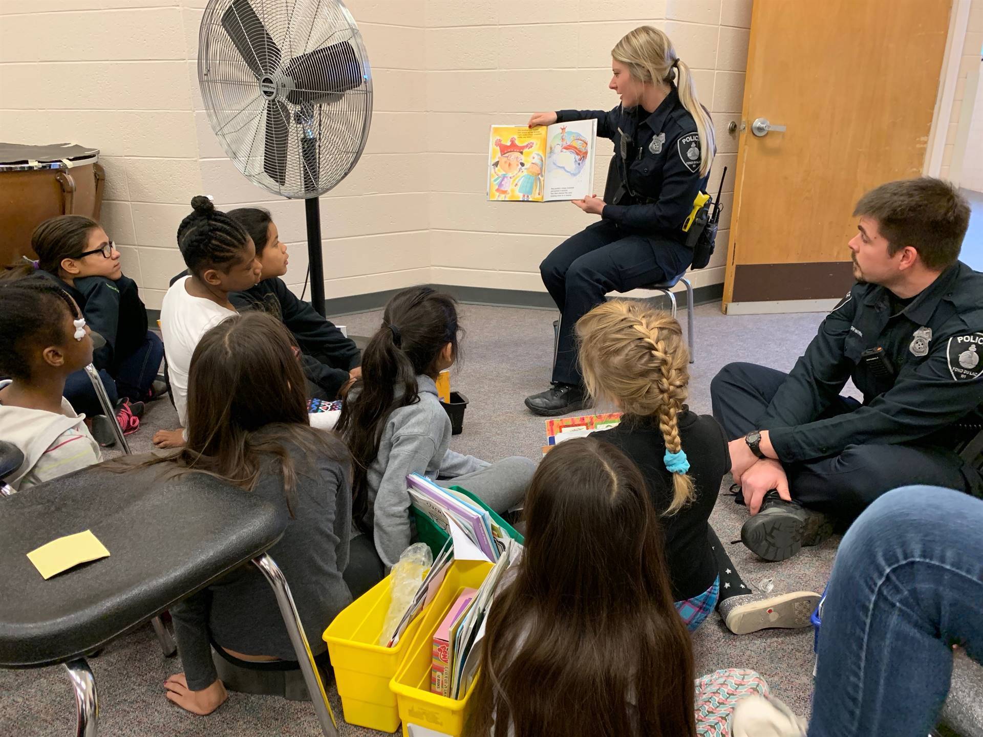 Officer reading to children